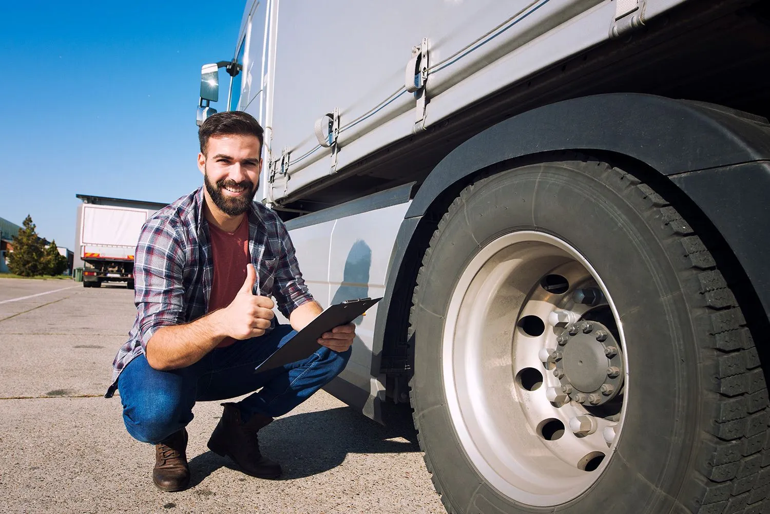 A parked semi-truck ready for axle and spindle service.